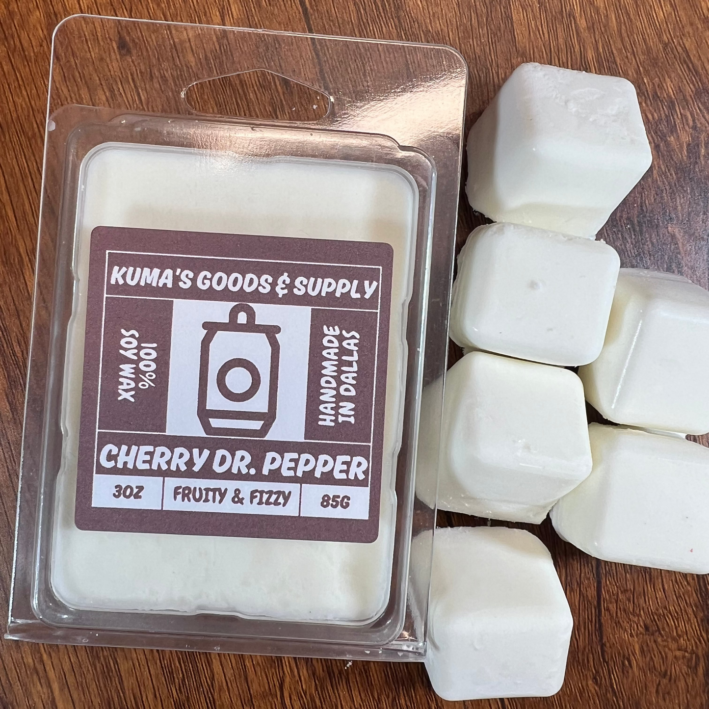 Kuma's Goods & Supply cherry Dr. Pepper wax melts on a wooden surface